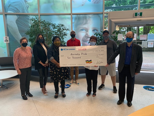 Pacific Blue Cross and CUPE 1816 members present Burnaby Pride with a donation cheque